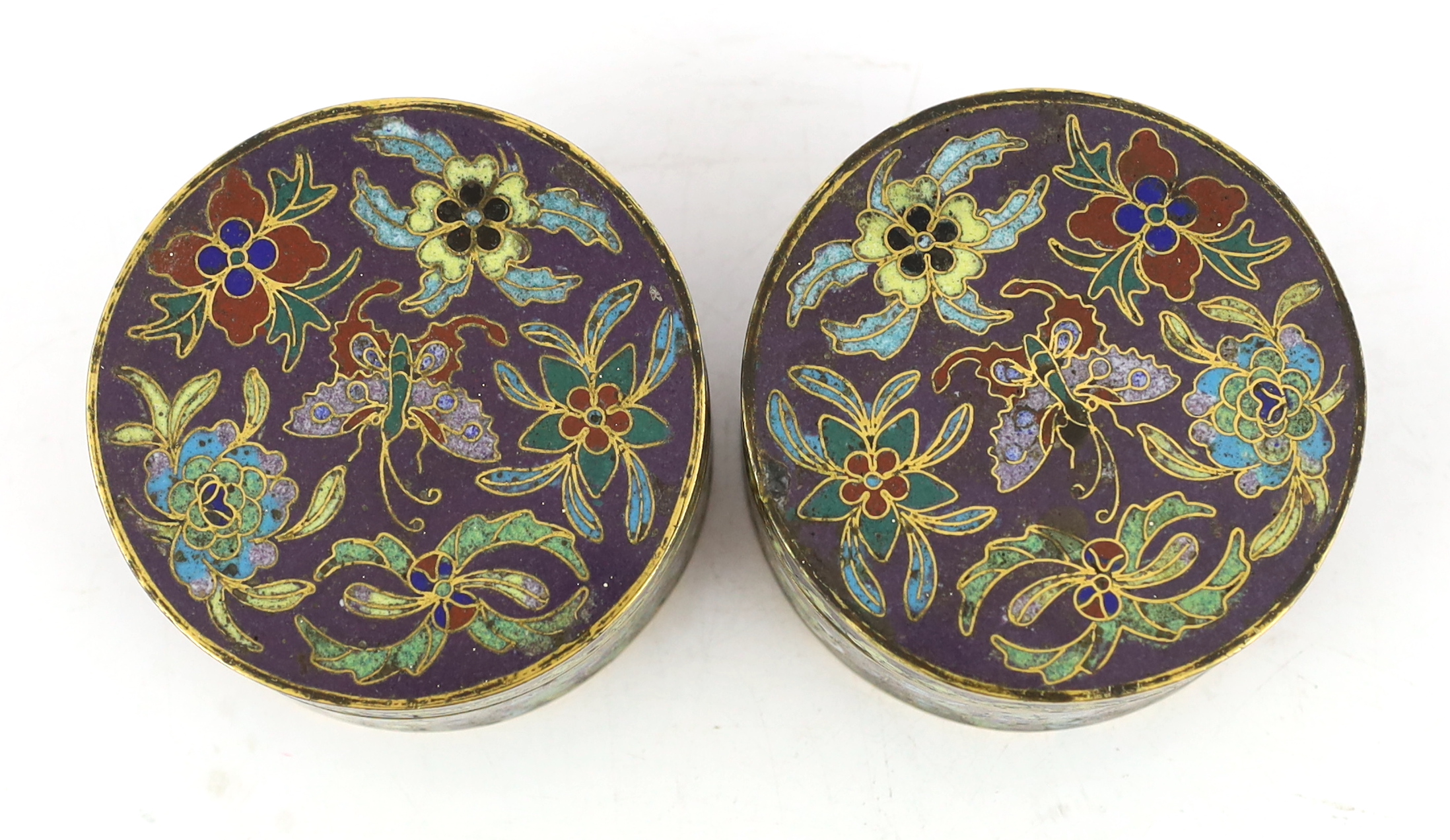 A pair of Chinese purple ground cloisonné enamel circular boxes and covers, 19th century, small losses enamel